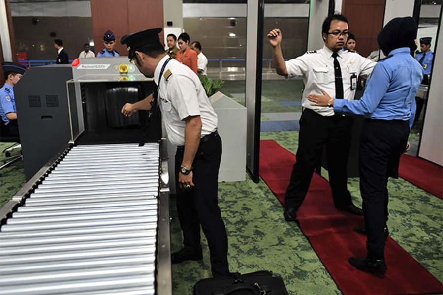Security screening checkpoint with X-ray baggage scanner in Ahmedabad